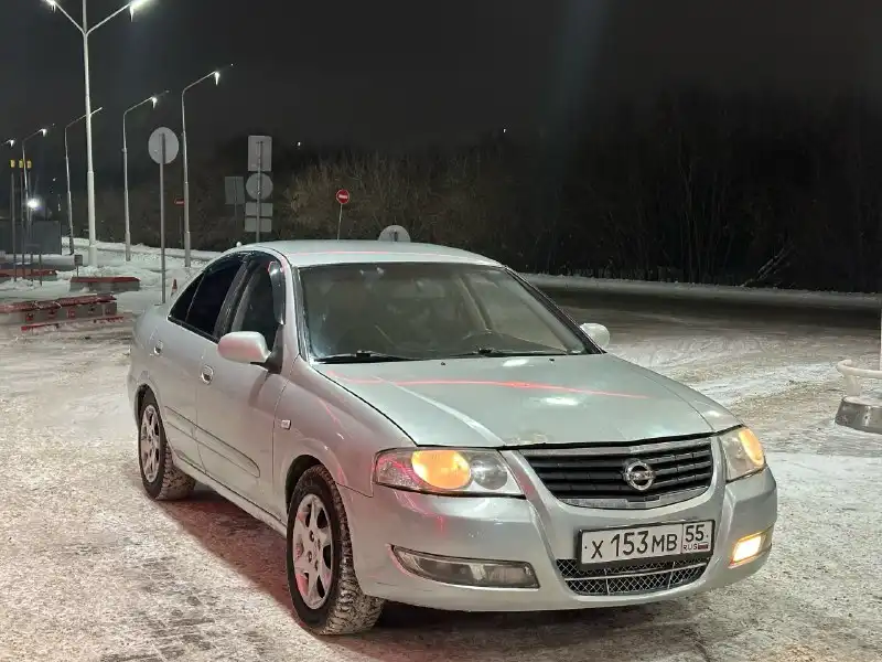 Фото автомобиля NISSAN ALMERA, 2007 — госномер Х153МВ55. Цвет: Серебристый
