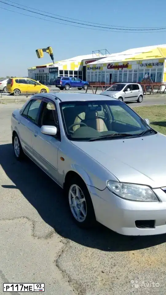Фото автомобиля MAZDA FAMILIA, 2001 — госномер Е235УР193