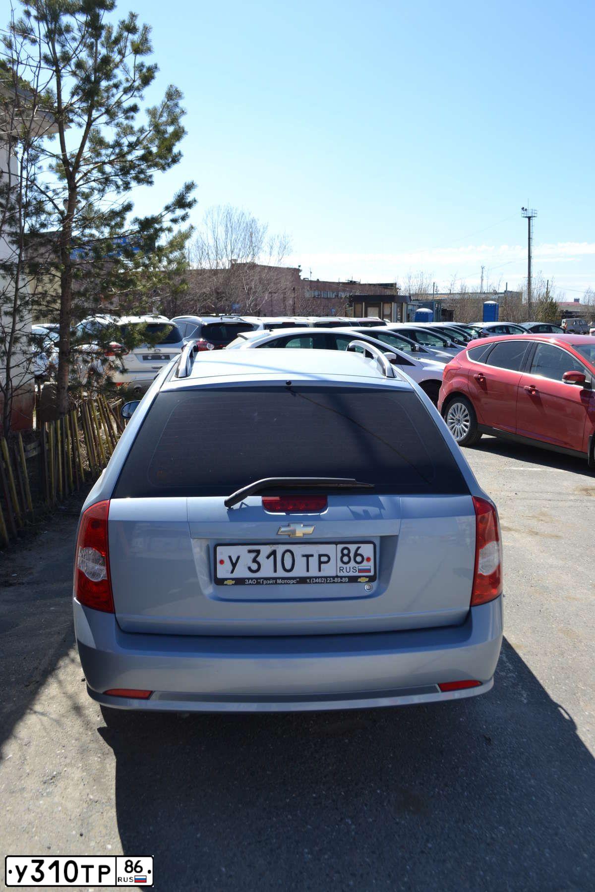 Фото автомобиля CHEVROLET LACETTI, 2009 — госномер А545МО155. Цвет: голубой