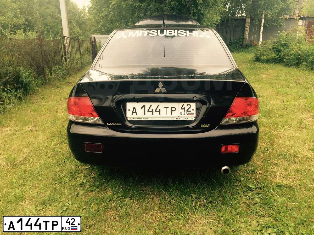 Фото автомобиля MITSUBISHI LANCER, 2005 — госномер Т321НУ142. Цвет: ЧЕРНЫЙ