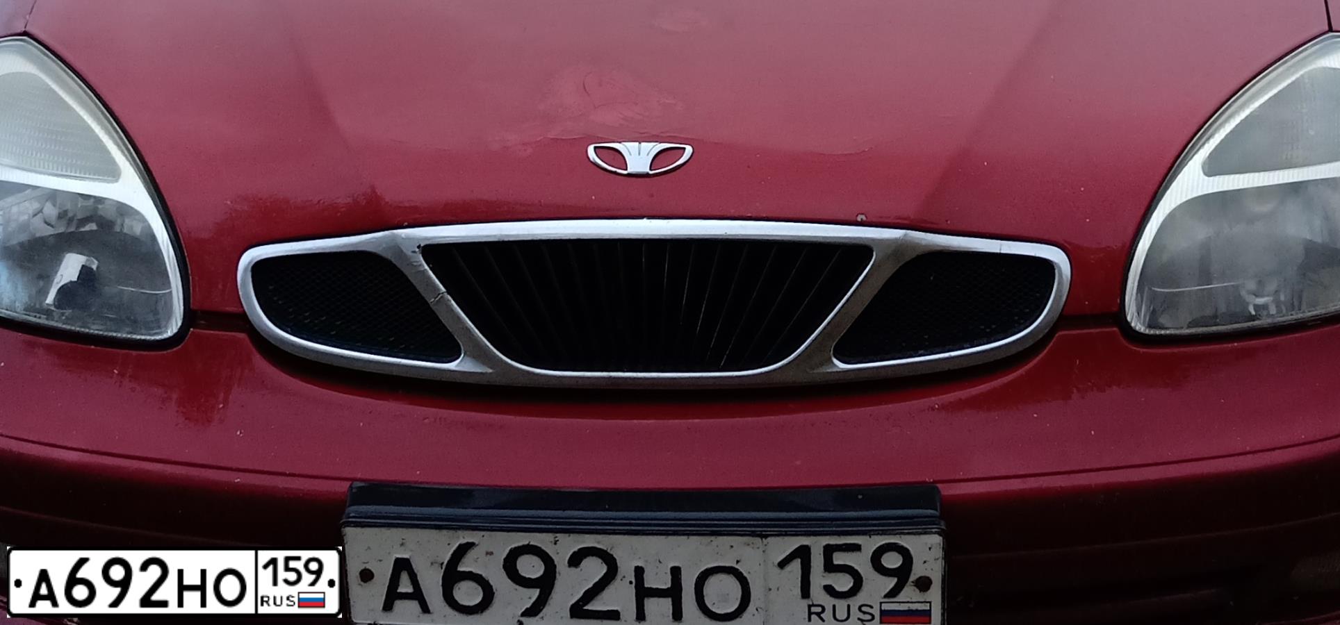 Фото автомобиля DAEWOO NUBIRA, 2000 — госномер С106ОТ198. Цвет: ТЕМНО-КРАСНЫЙ