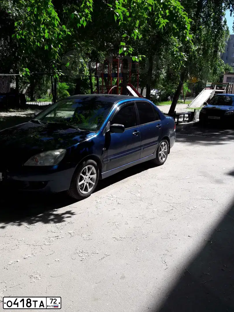 Фото автомобиля LADA 2190 GRANTA, 2013 — госномер О418ТА72. Цвет: СИНЕ-ЧЕРНЫЙ