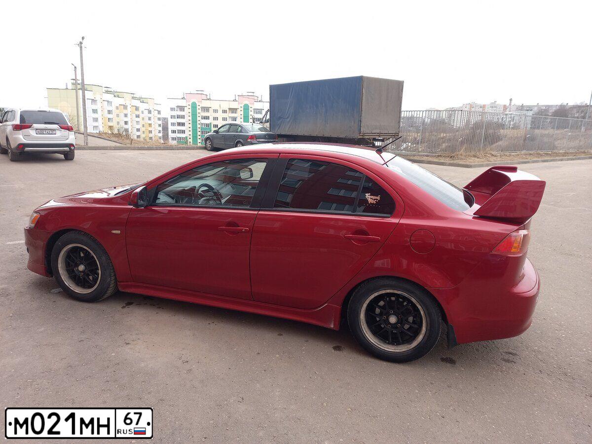 Фото автомобиля MITSUBISHI LANCER, 2007 — госномер М021МН67. Цвет: Красный