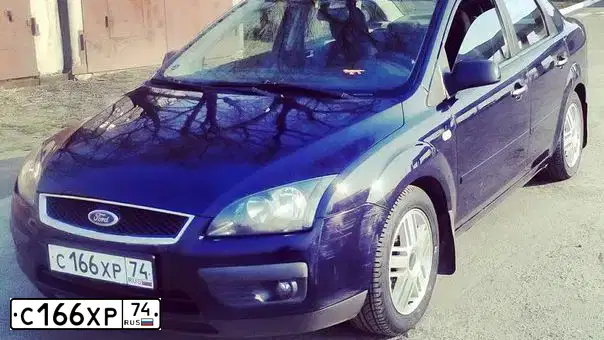 Фото автомобиля FORD FOCUS, 2006 — госномер О734ЕН774. Цвет: Темно-синий