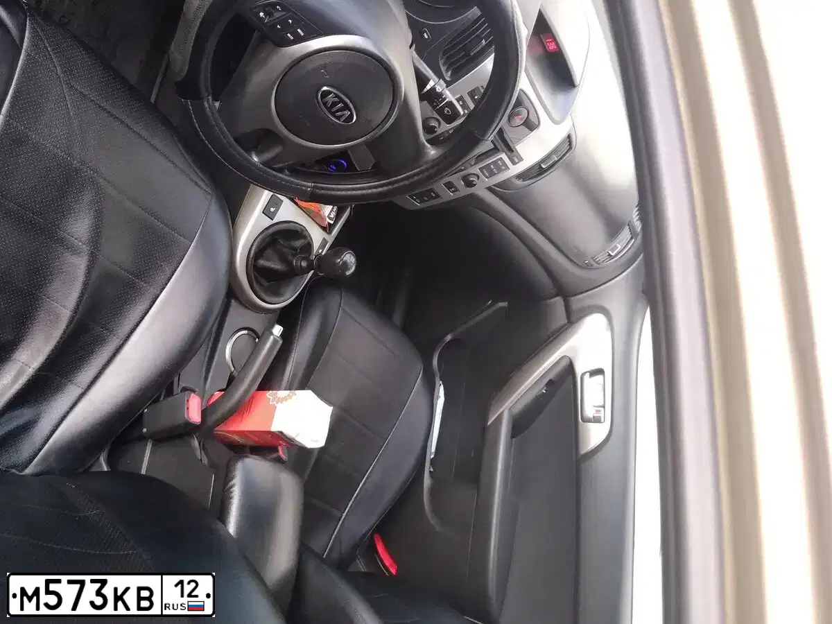 Фото автомобиля KIA CERATO, 2009 — госномер М573КВ12. Цвет: ЗОЛОТИСТЫЙ