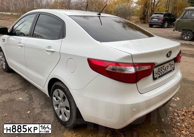 Фото автомобиля КИА РИО, 2014 — госномер Х755ЕР164. Цвет: Белый