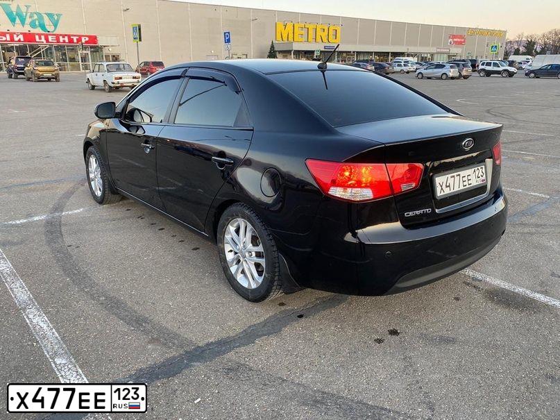 Фото автомобиля KIA CERATO, 2012 — госномер Т200НТ05. Цвет: ЧЕРНЫЙ