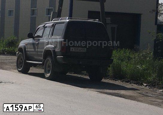 Фото автомобиля TOYOTA LANDCRUISER, 1992 — госномер А159АР65. Цвет: ЗЕЛЕНЫЙ