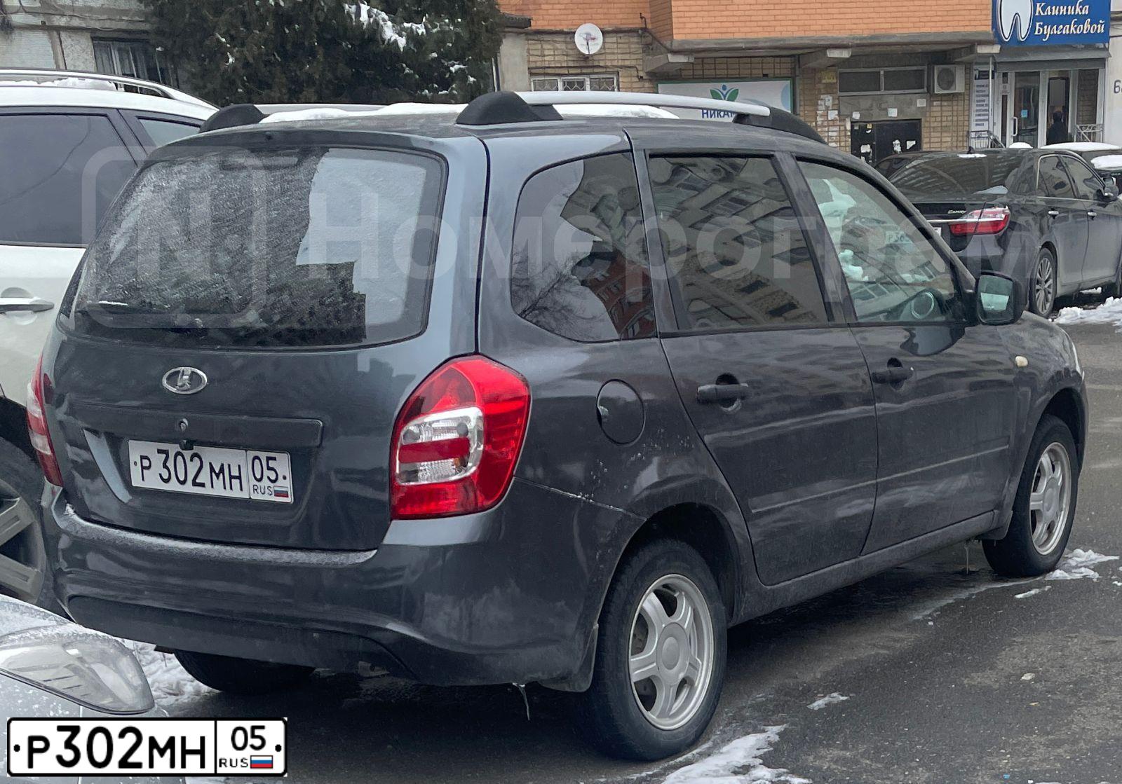 Фото автомобиля LADA 2194 KALINA, 2014 — госномер Р302МН05. Цвет: серебристо-темно-серый