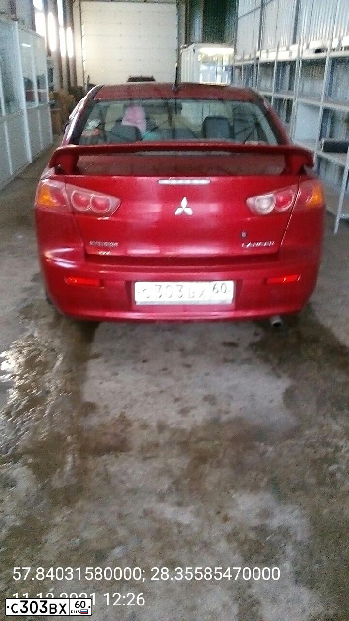 Фото автомобиля MITSUBISHI LANCER, 2007 — госномер С303ВХ60. Цвет: Красный