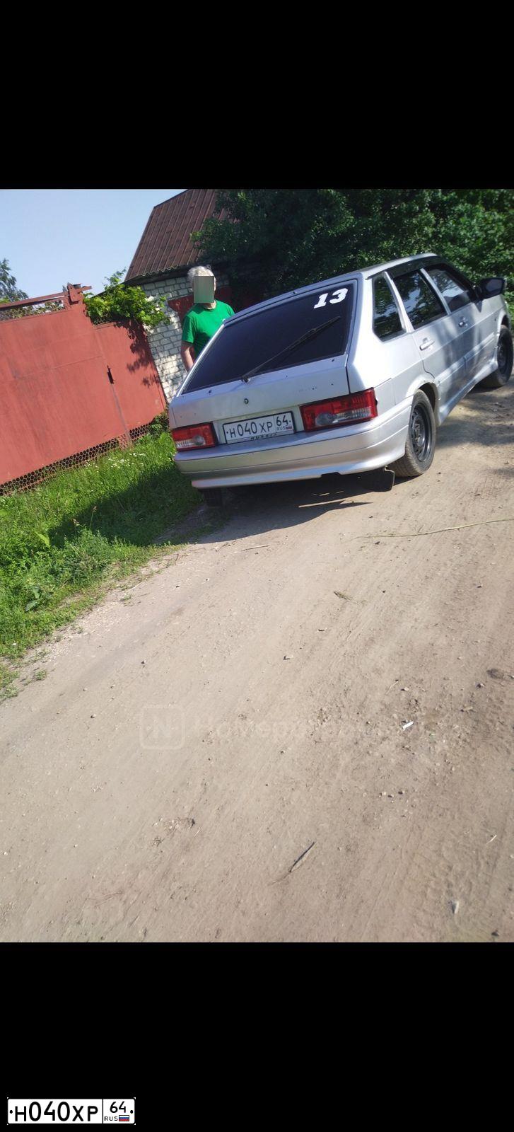 Фото автомобиля LADA 2109 SAMARA, 2003 — госномер Н040ХР64. Цвет: СЕРЕБРИСТЫЙ