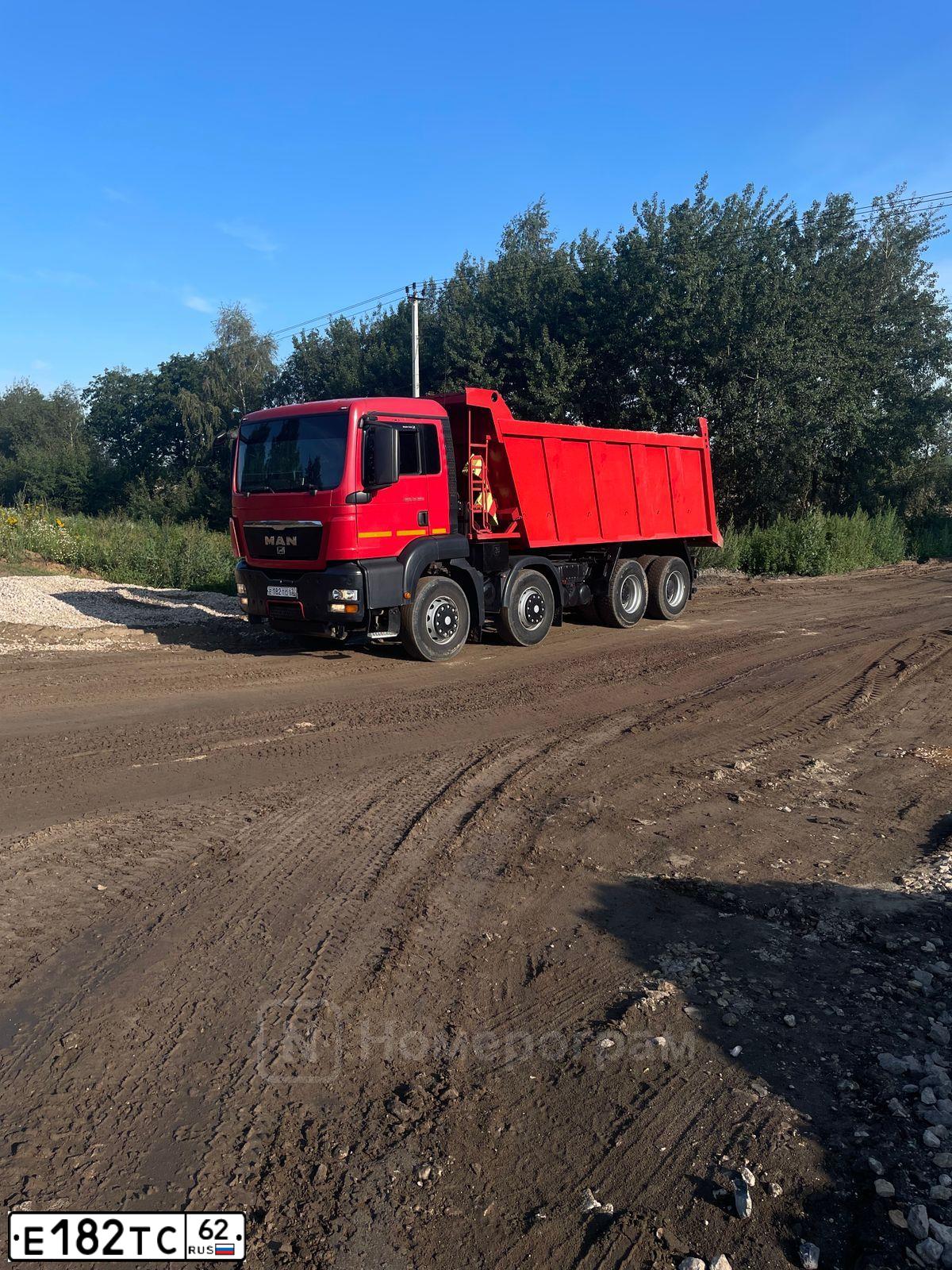 Фото автомобиля MAN TGS 41.XXX /8X4/, 2013 — госномер Е182ТС62. Цвет: Красный