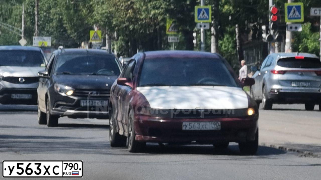 Фото автомобиля MITSUBISHI LANCER, 2008 — госномер У563ХС790. Цвет: ЧЕРНЫЙ