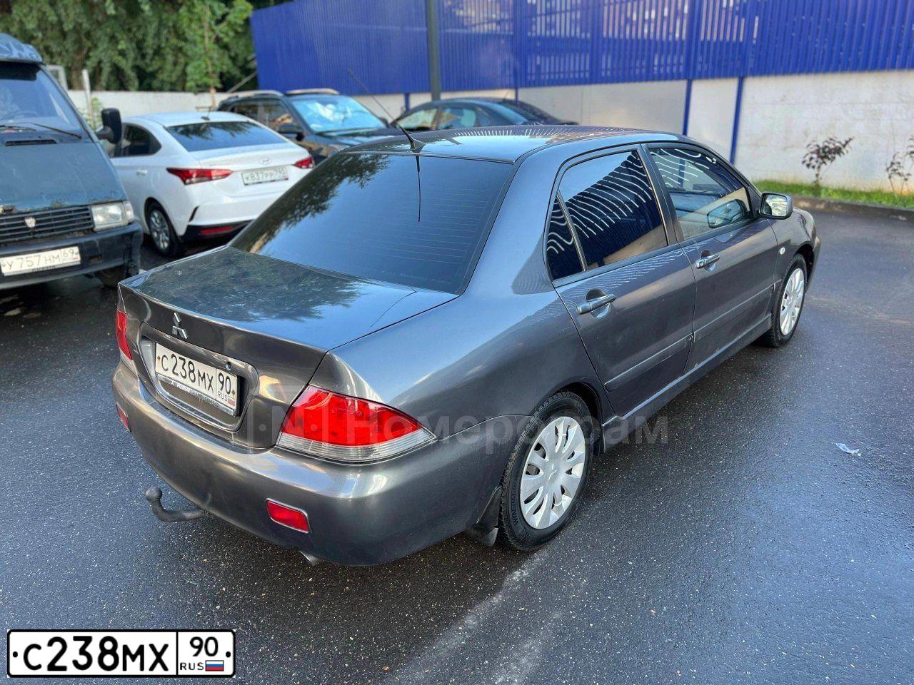 Фото автомобиля MITSUBISHI LANCER, 2005 — госномер В024АТ550. Цвет: Серый