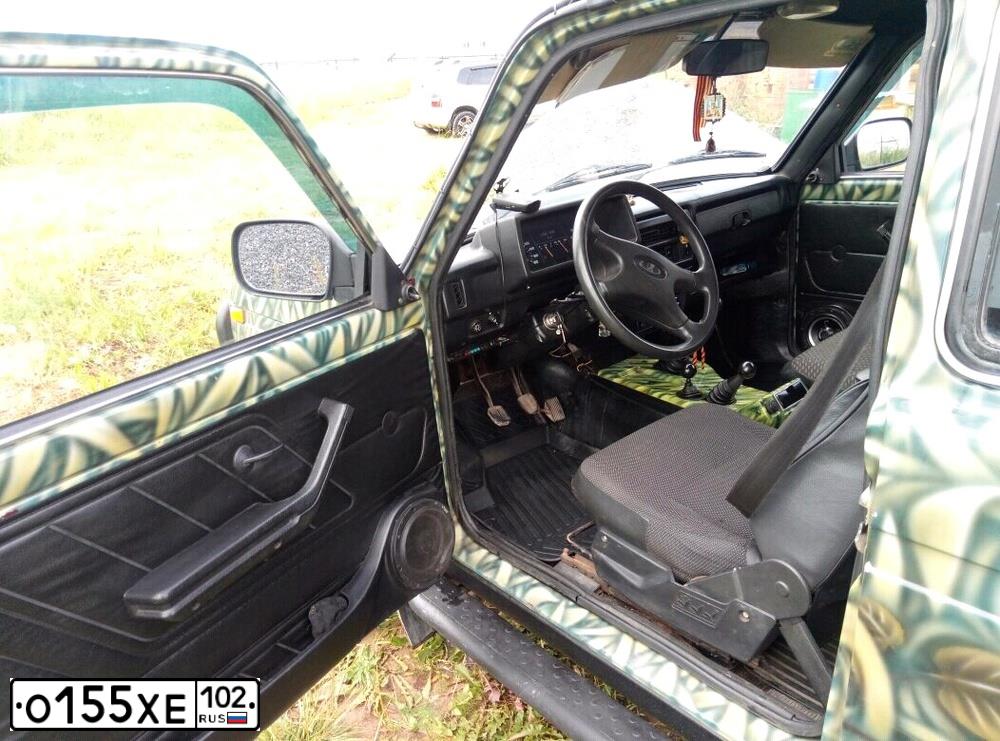 Фото автомобиля LADA 2121 NIVA, 2002 — госномер Х111КО56. Цвет: ЗЕЛЕНЫЙ КАМУФЛЯЖ