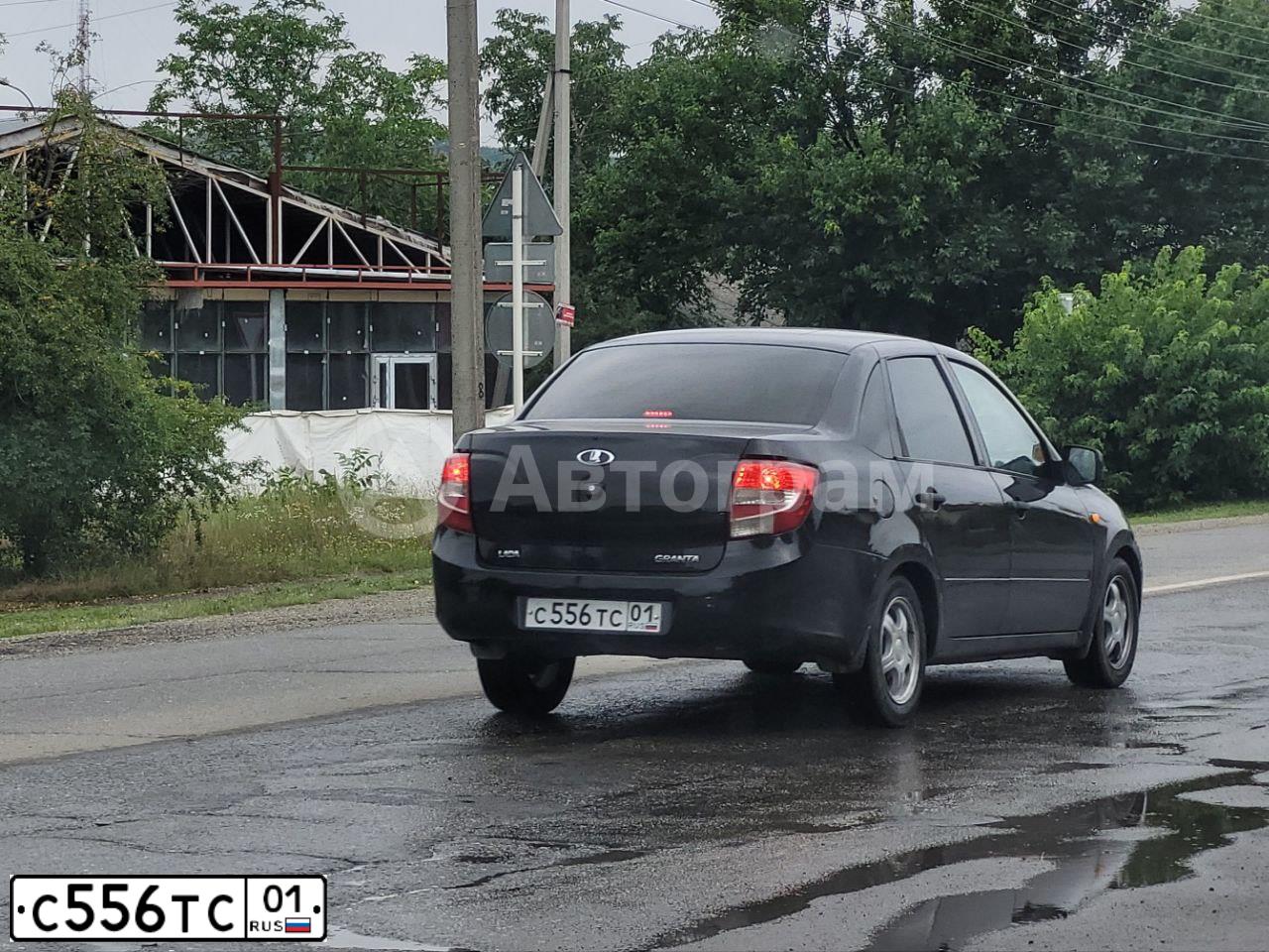Фото автомобиля LADA 2190 GRANTA, 2013 — госномер С556ТС01. Цвет: ЧЕРНЫЙ