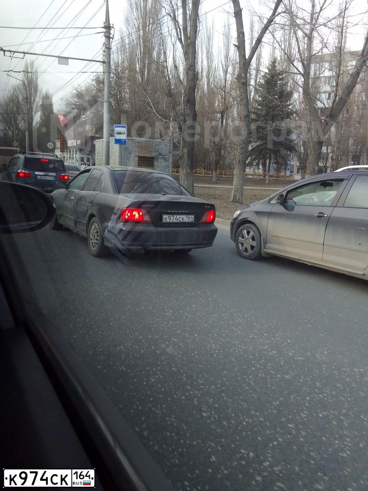Фото автомобиля MITSUBISHI GALANT, 2002 — госномер К974СК164. Цвет: ЧЕРНЫЙ