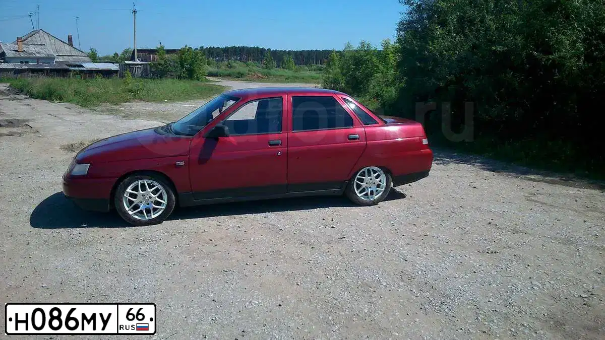 Фото автомобиля LADA 2110, 2001 — госномер Н086МУ66. Цвет: СЕРЕБРИСТО-КРАСНЫЙ