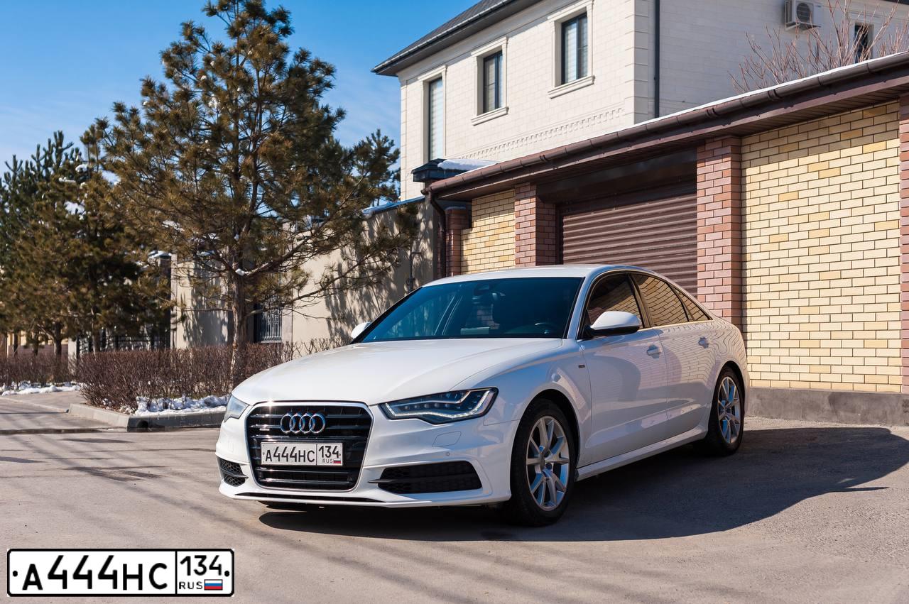 Фото автомобиля AUDI A4, 2010 — госномер Е618ОВ134. Цвет: Белый