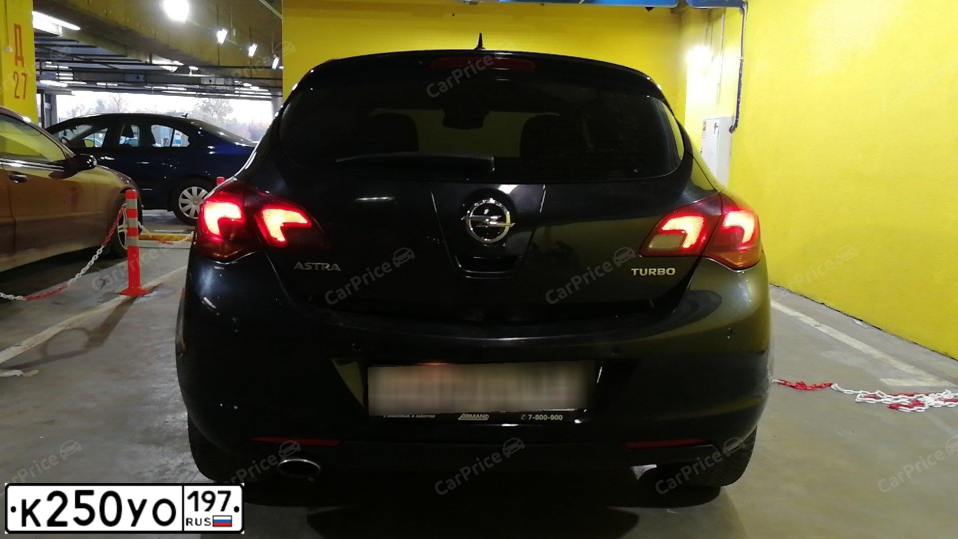 Фото автомобиля OPEL ASTRA, 2012 — госномер К250УО197. Цвет: ЧЕРНЫЙ