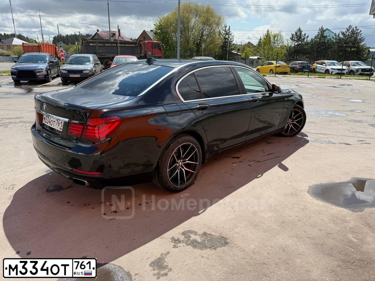 Фото автомобиля BMW SERIE 7, 2012 — госномер М334ОТ761. Цвет: ЧЕРНЫЙ