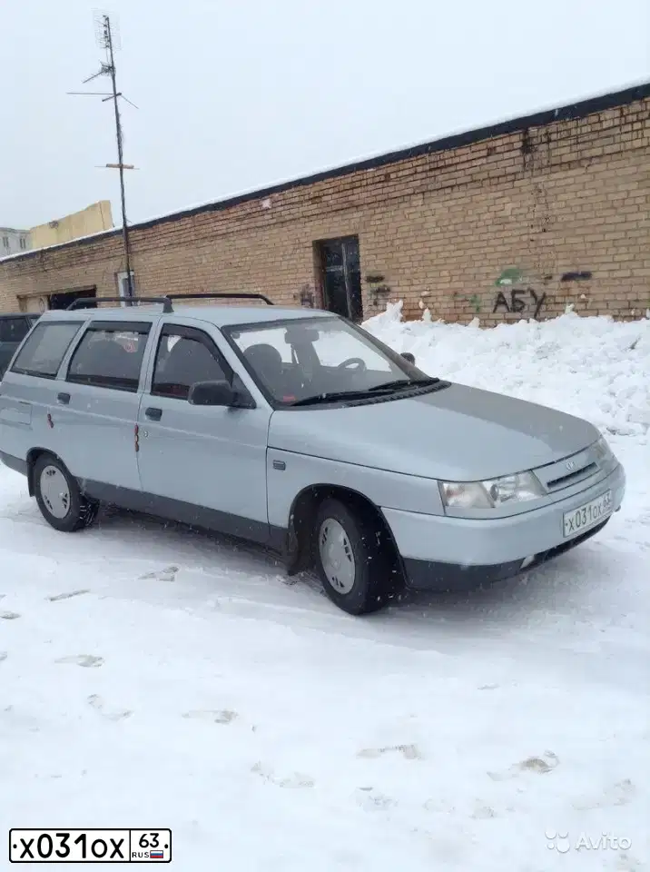 Фото автомобиля LADA 2111, 2002 — госномер Х031ОХ63. Цвет: СЕРЕБРИСТО-ГОЛУБОЙ