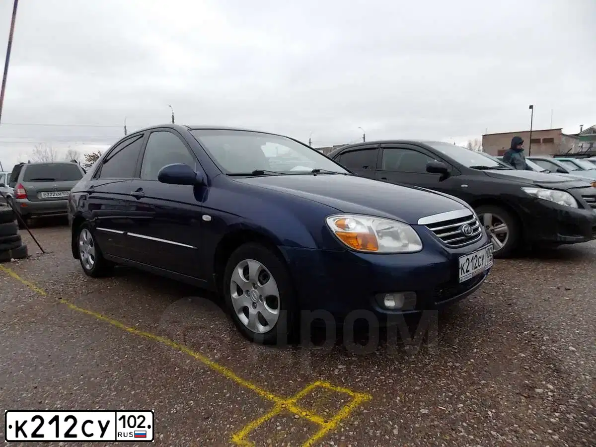 Фото автомобиля HYUNDAI /S-/COUPE / TUSCANI, 2003 — госномер К212СУ102. Цвет: Бело-серо-черный