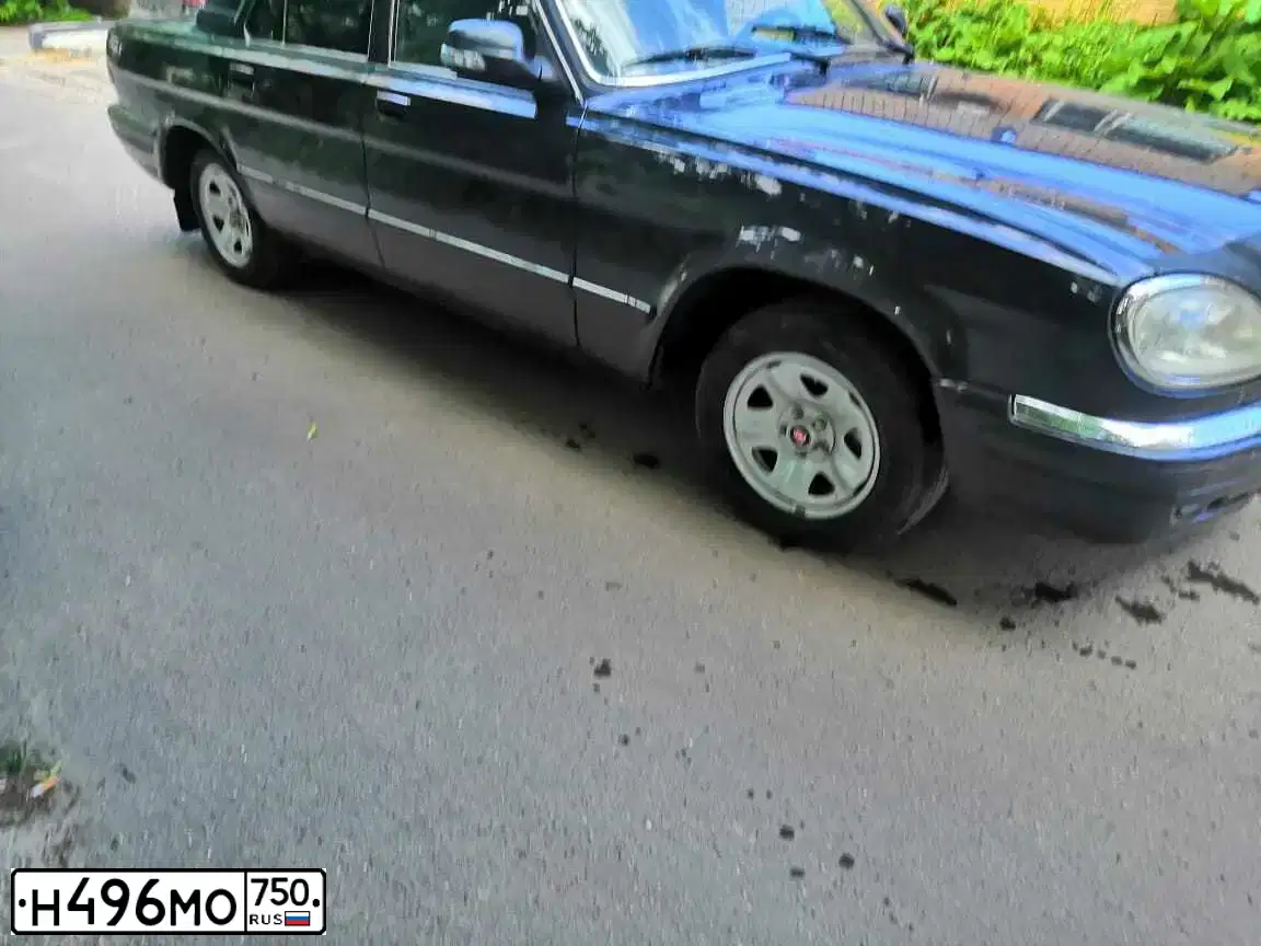 Фото автомобиля GAZ 3110 WOLGA, 2008 — госномер Р221ОТ199. Цвет: ЧЕРНЫЙ