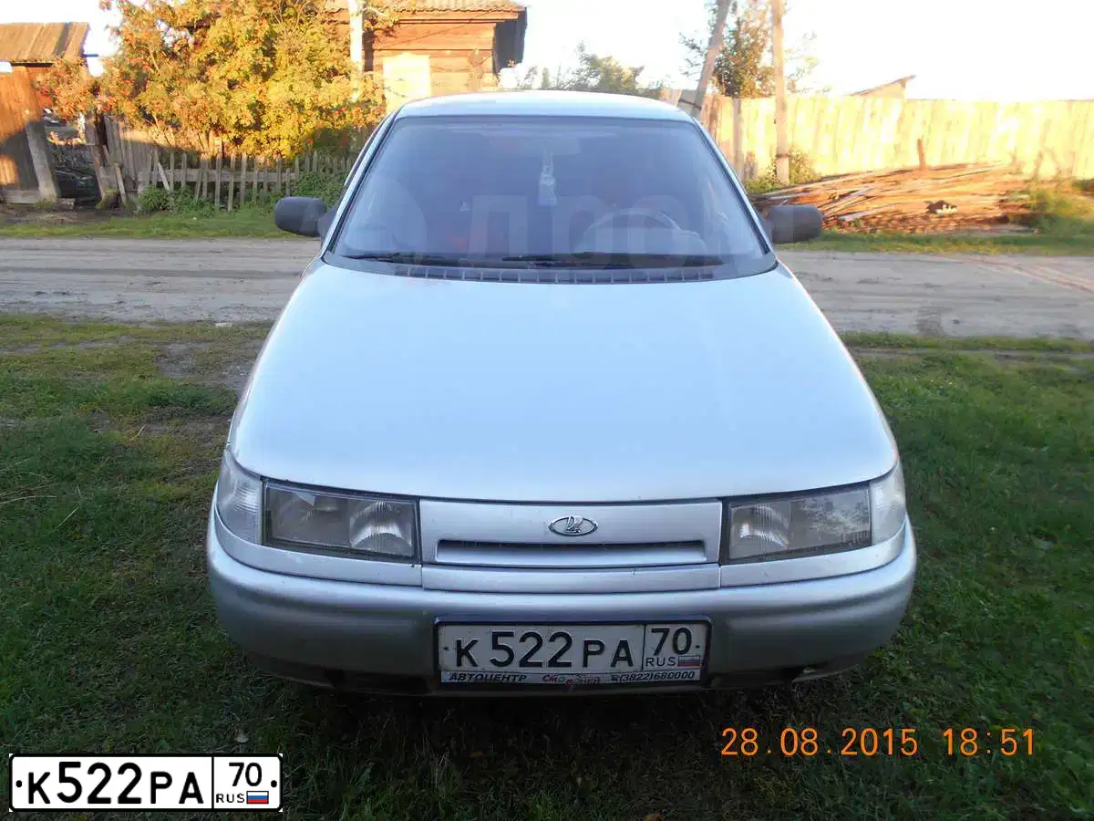 Фото автомобиля LADA 2112, 2002 — госномер Н191ЕТ70. Цвет: СЕРЫЙ