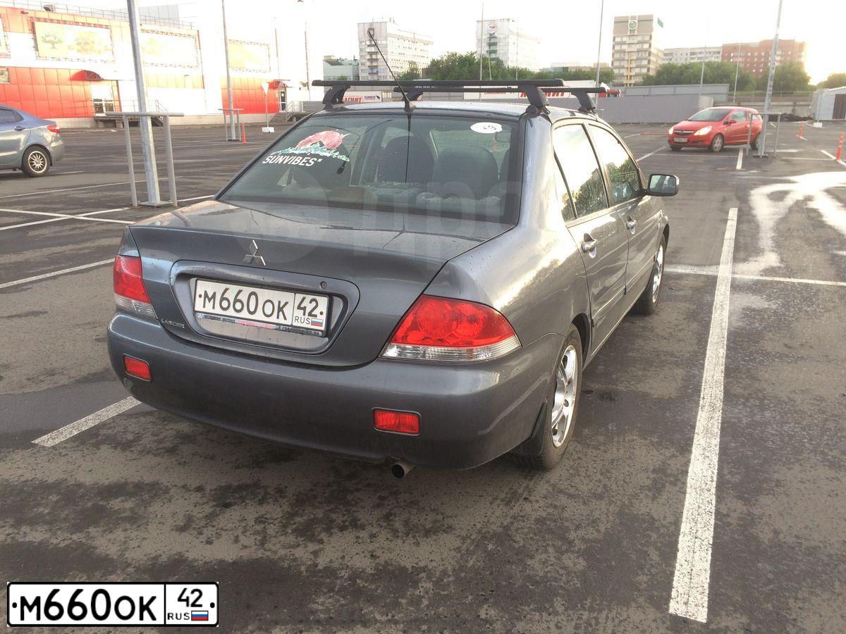 Фото автомобиля MITSUBISHI LANCER, 2005 — госномер М660ОК42. Цвет: СЕРЫЙ
