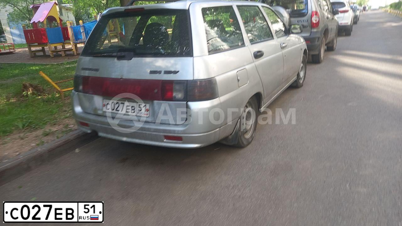 Фото автомобиля LADA 2111, 2005 — госномер С027ЕВ51. Цвет: СВЕТЛО-СЕРЕБРИСТЫЙ