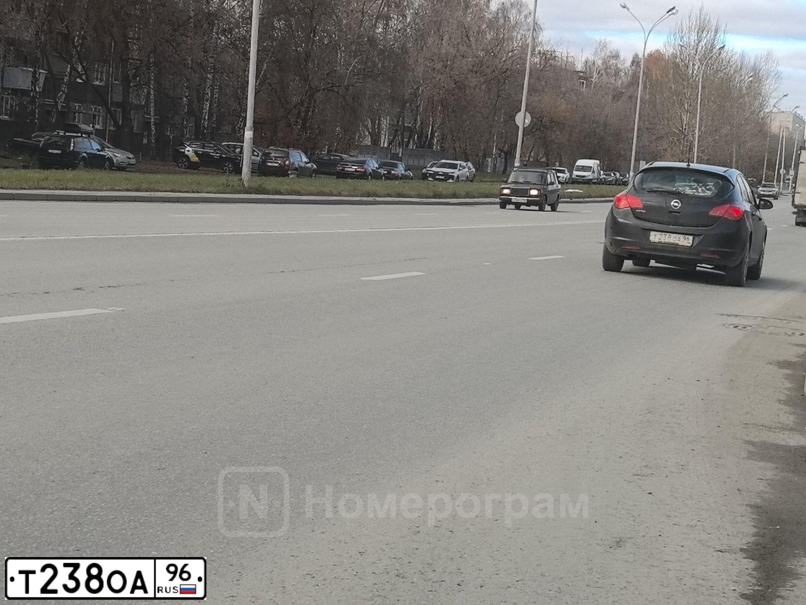 Фото автомобиля OPEL ASTRA, 2011 — госномер Т238ОА96. Цвет: ЧЕРНЫЙ