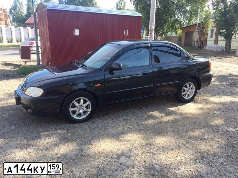 Фото автомобиля KIA SPECTRA, 2007 — госномер У074ХВ174. Цвет: ЧЕРНЫЙ