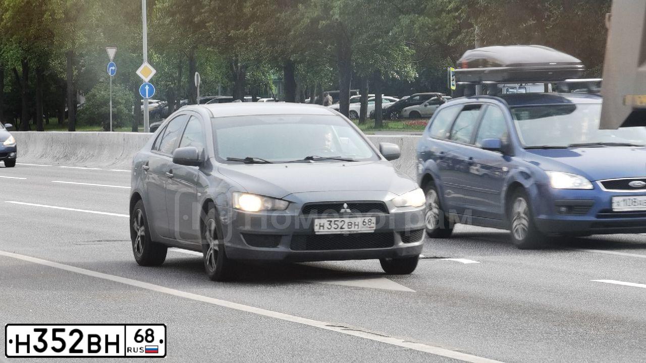 Фото автомобиля MITSUBISHI LANCER, 2008 — госномер О875ЕК977. Цвет: СЕРЫЙ