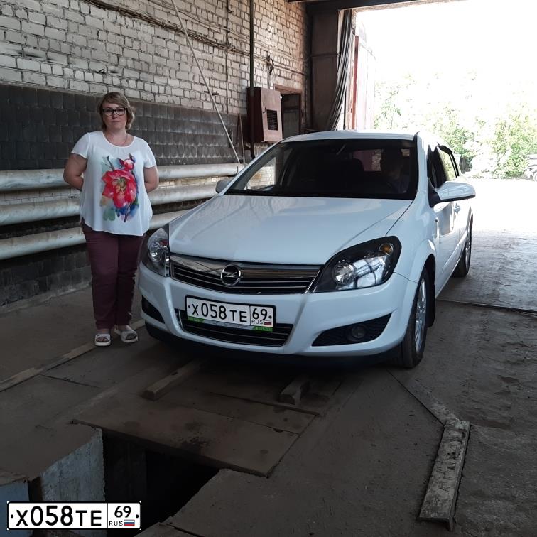 Фото автомобиля OPEL ASTRA, 2008 — госномер Х058ТЕ69. Цвет: Белый
