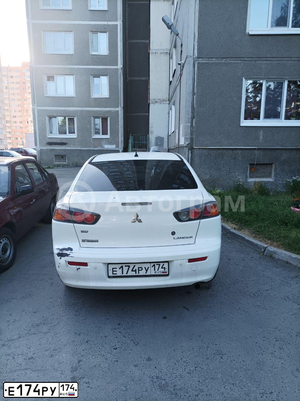 Фото автомобиля MITSUBISHI GALANT, 2001 — госномер Е174РУ174. Цвет: ЧЕРНЫЙ