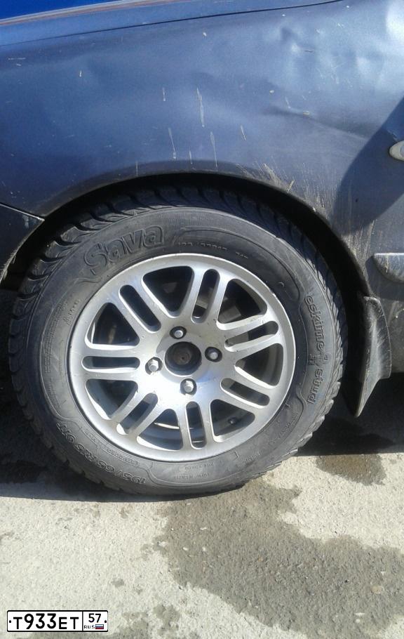 Фото автомобиля MITSUBISHI LANCER, 2004 — госномер Т933ЕТ57. Цвет: Серый