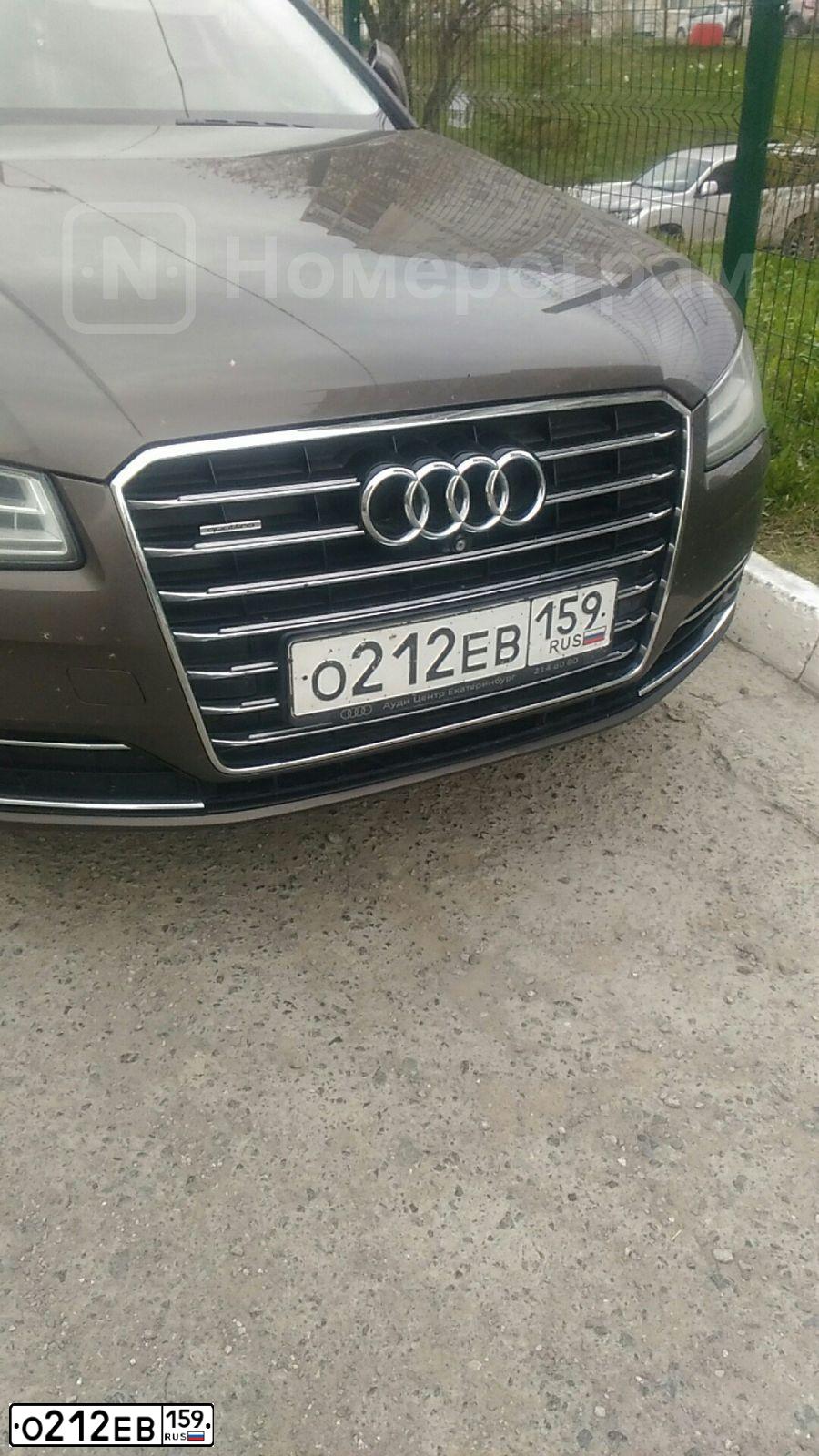 Фото автомобиля AUDI A8, 2015 — госномер О212ЕВ159. Цвет: Коричневый