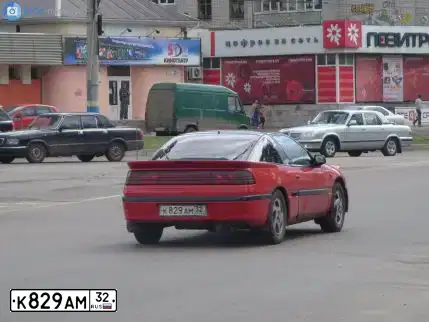 Фото автомобиля MITSUBISHI ECLIPSE, 1992 — госномер М861РВ32. Цвет: Красный