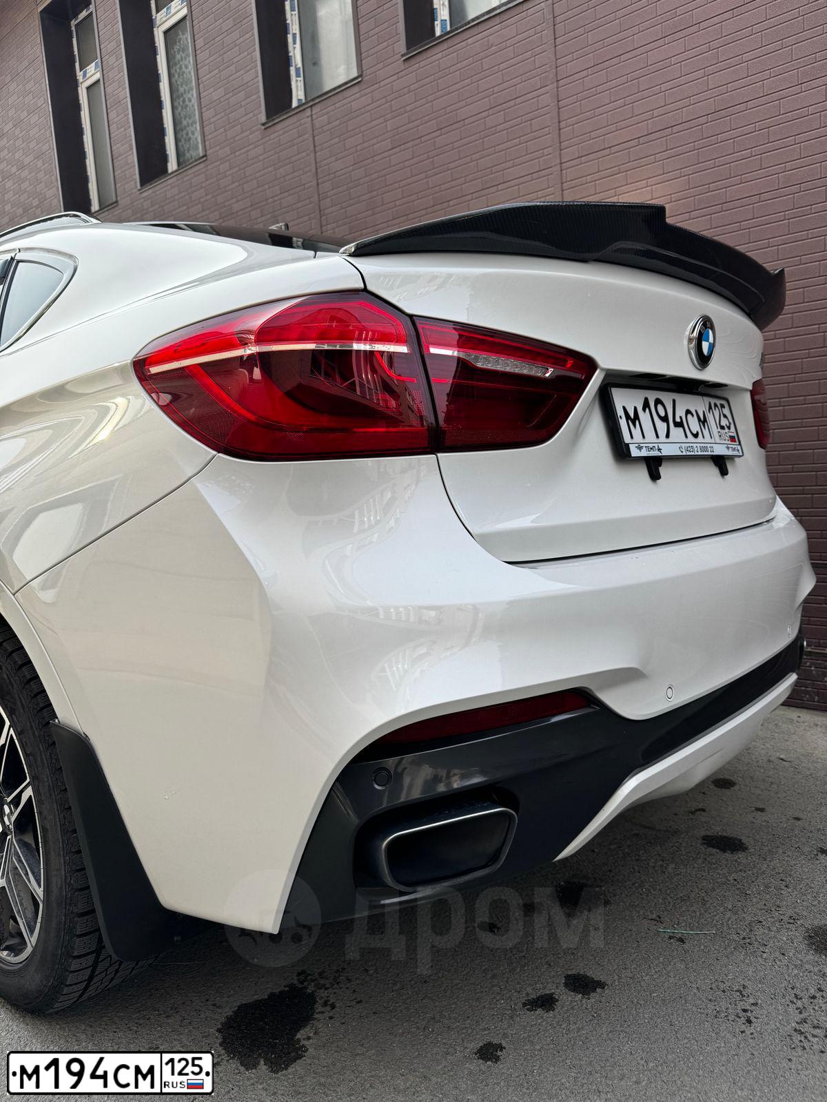 Фото автомобиля BMW X6, 2017 — госномер М194СМ125. Цвет: Белый