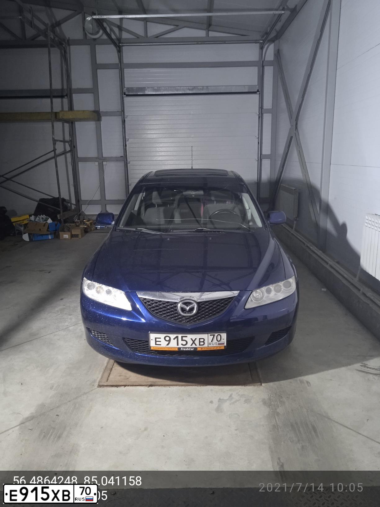 Фото автомобиля MAZDA 6, 2004 — госномер Е915ХВ70. Цвет: ТЕМНО-СИНИЙ