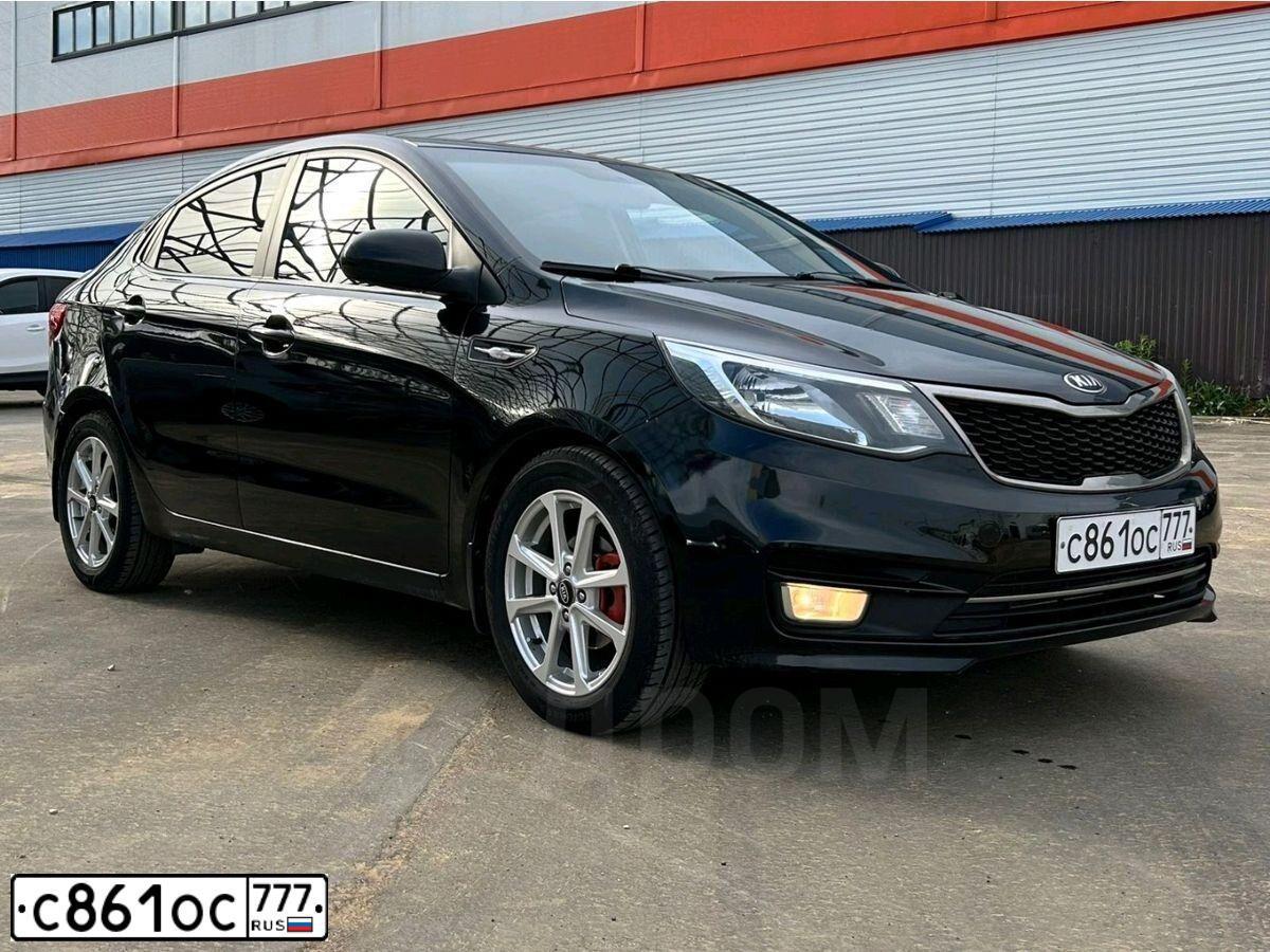 Фото автомобиля KIA RIO, 2015 — госномер Т232УЕ71. Цвет: ЧЕРНЫЙ