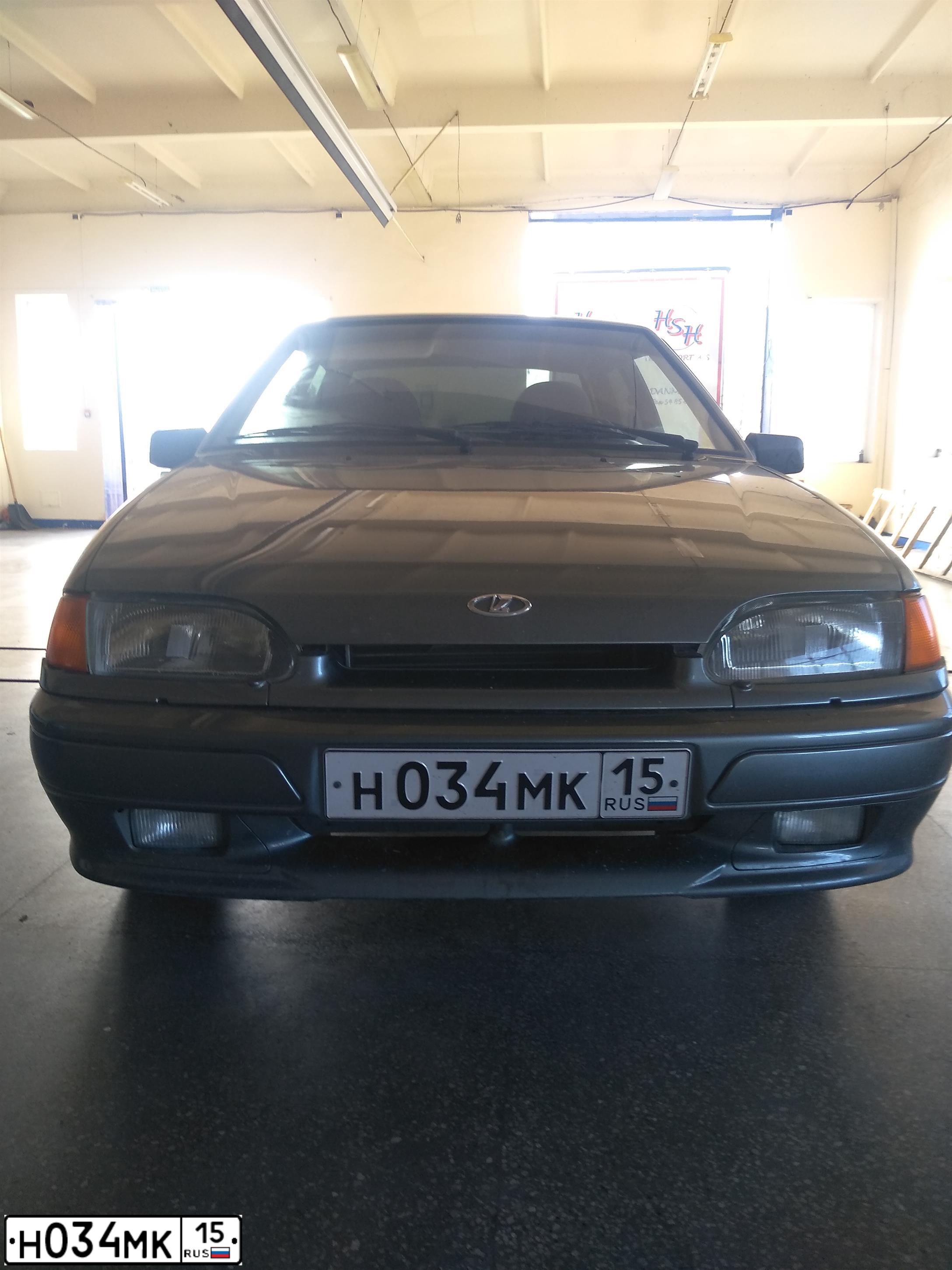 Фото автомобиля LADA 2115 SAMARA, 2010 — госномер Н034МК15. Цвет: средний серо-зеленый металлик