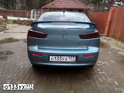 Фото автомобиля MITSUBISHI LANCER, 2007 — госномер О737ХА32. Цвет: СВЕТЛО-СЕРО-ЗЕЛЕНЫЙ