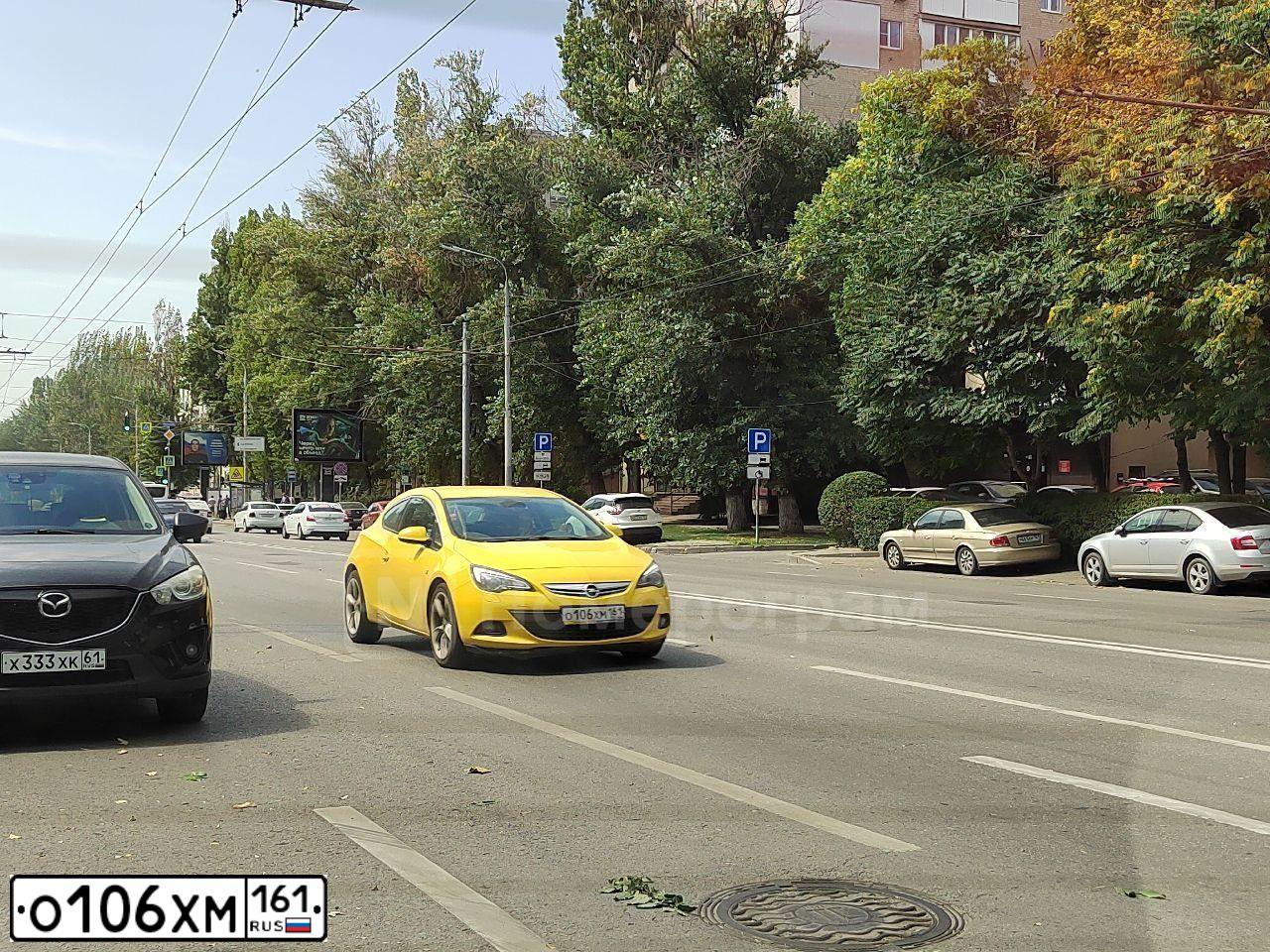 Фото автомобиля OPEL ASTRA, 2014 — госномер Х010РТ161. Цвет: ЖЁЛТЫЙ