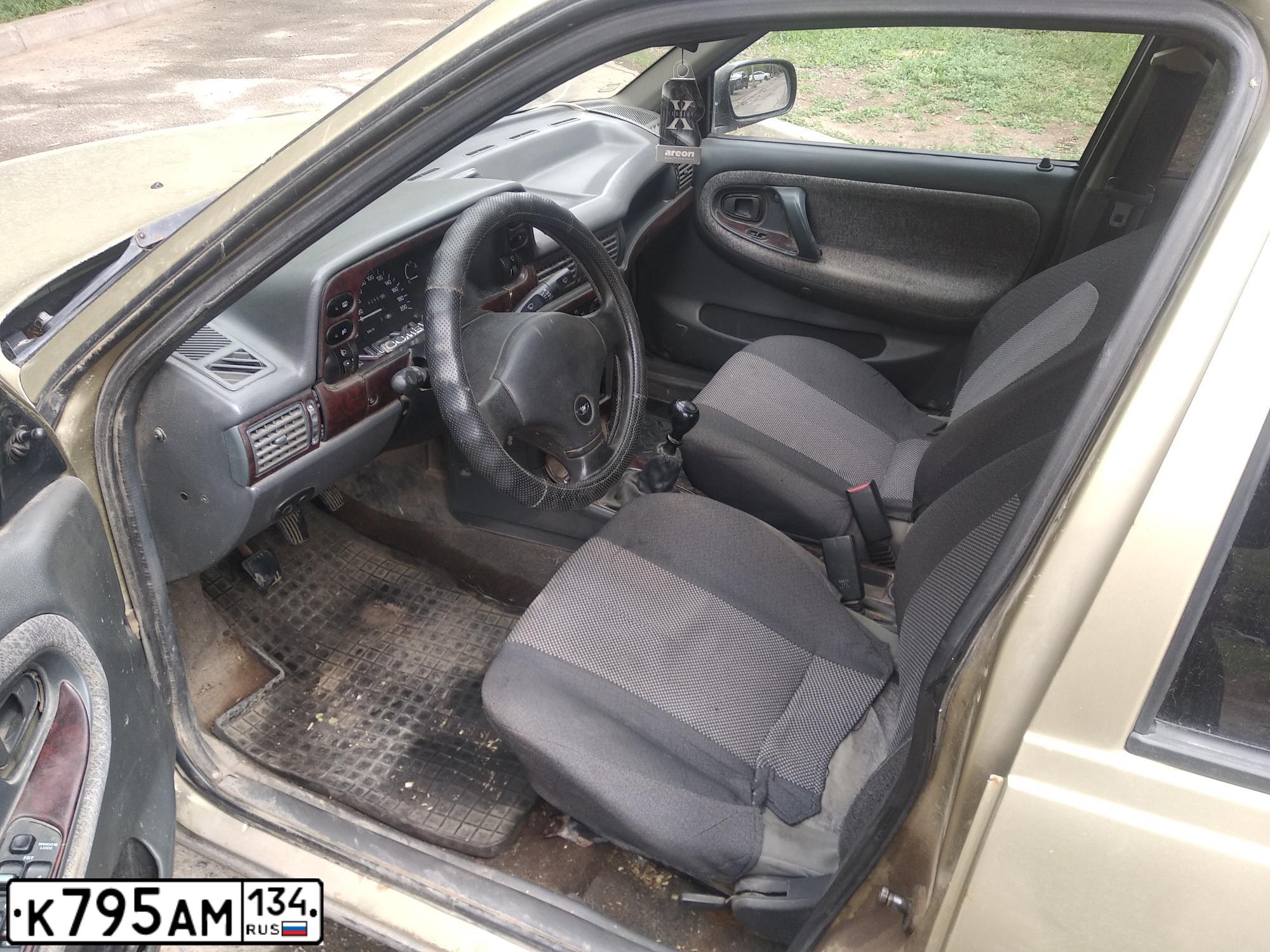 Фото автомобиля DAEWOO NEXIA, 2006 — госномер К795АМ134. Цвет: СЕРЕБРИСТО-БЕЖЕВЫЙ