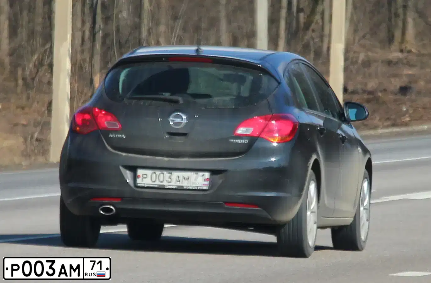 Фото автомобиля OPEL ASTRA, 2012 — госномер Р003АМ71. Цвет: ЧЕРНЫЙ МЕТАЛЛИК