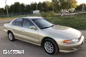 Фото автомобиля MITSUBISHI GALANT, 2000 — госномер Е714КХ87. Цвет: ЗОЛОТИСТЫЙ