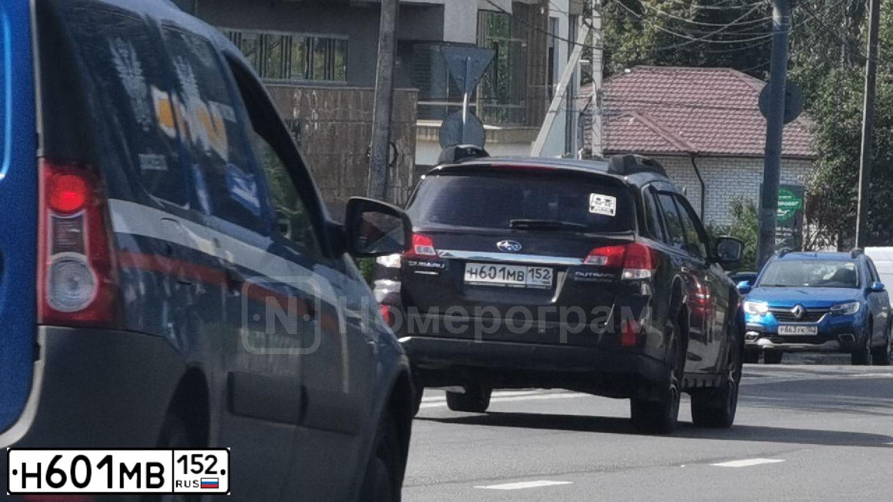 Фото автомобиля SUBARU OUTBACK, 2014 — госномер Н601МВ152. Цвет: Красный