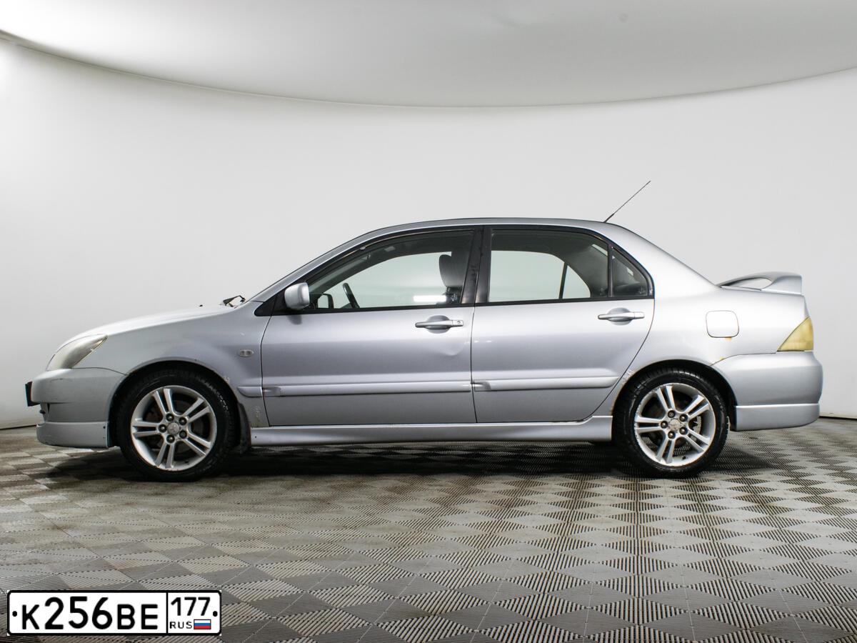Фото автомобиля MITSUBISHI LANCER, 2005 — госномер К256ВЕ177. Цвет: СЕРЫЙ